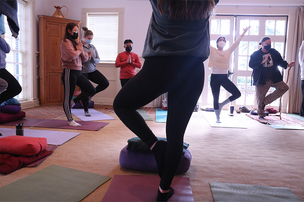 BSN class of 2023 graduates at Morven Farm retreat doing yoga with Compassionate Care Initiative facilitators.