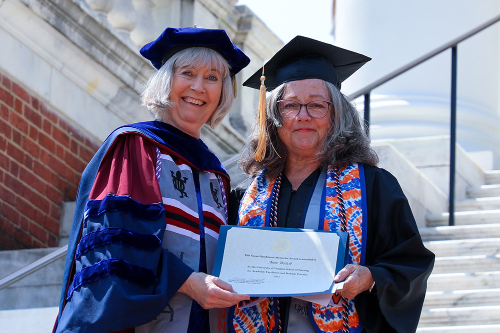 RN to BSN graduate in the class of 2023 Ann Welch earned an award at graduation presented by Dean Baernholdt.