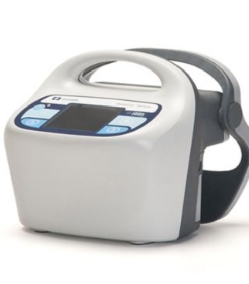 A close-up studio shot of a portable DVT (Deep Vein Thrombosis) intermittent compression pump with a gray leg cuff attached.