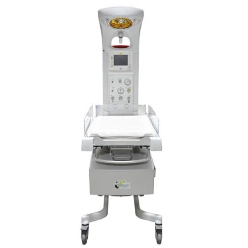 An infant warmer on wheels with a top-mounted control panel and a crib on a medical stand.