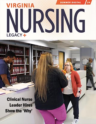 Two nurses talking in a hallway